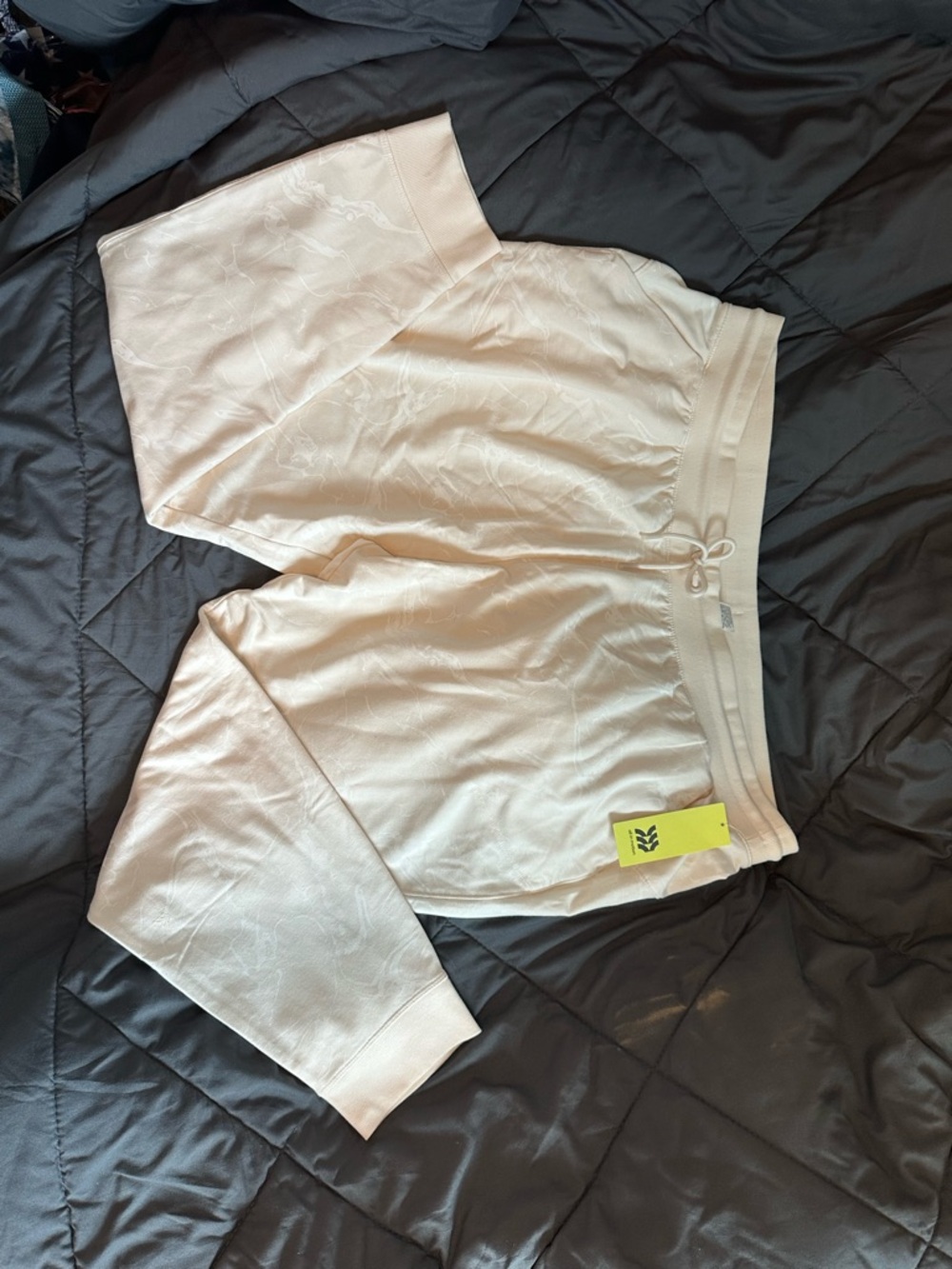 All in Motion Cream color with white print joggers/sweatpants